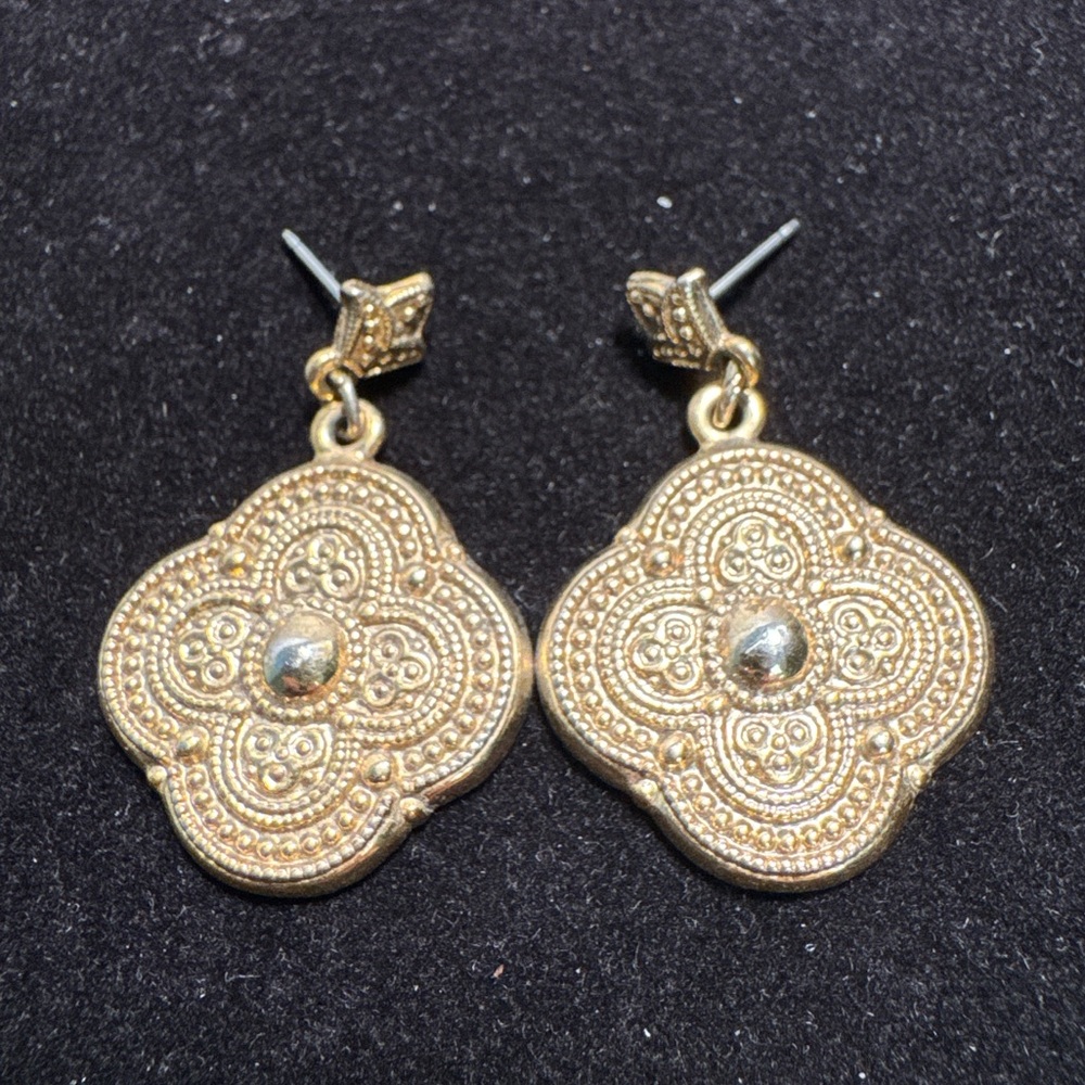 Gold-tone quatrefoil or clover dangle earrings. Ornate textured filigree design